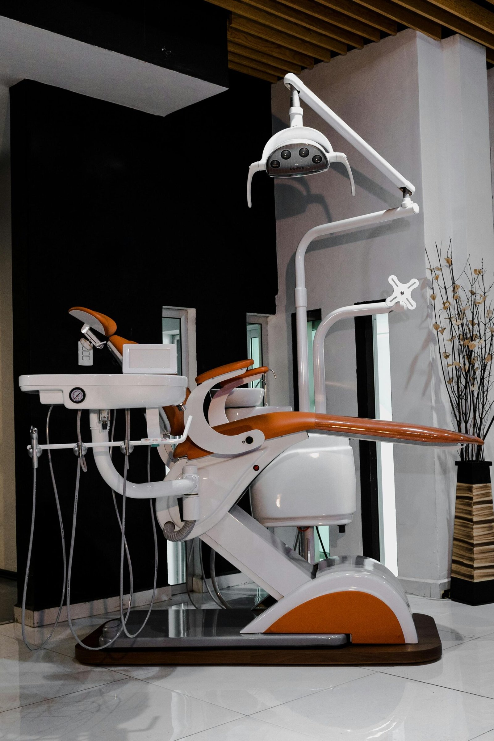 High-tech dental chair and equipment in a sleek, modern dental clinic